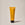 A yellow tube of ACURE Resurfacing 1% Glycolic Acid & Unicorn Root Cleanser on a neutral background.